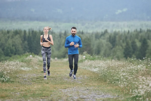 Couple jogging outdoor on gloomy day