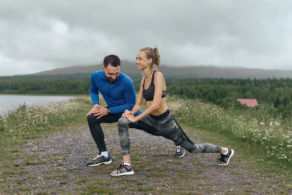 Man and woman exercising together outdoor