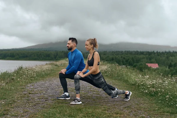 Man and woman exercising together outdoor