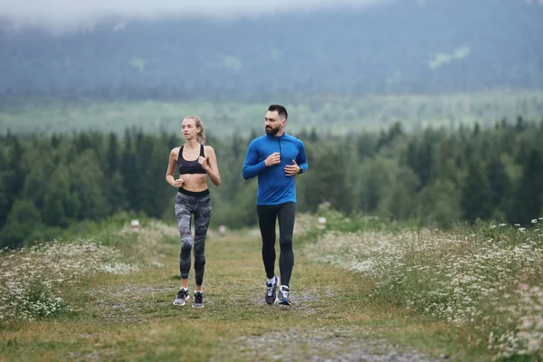 Man and woman jogging together outdoor