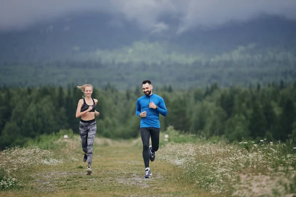 Trainer and female sportsman jogging outdoor