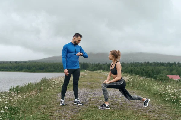 Man and woman exercising together outdoor