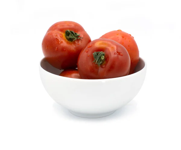 Tomatoes in white porcelain bowl — Stock Photo, Image