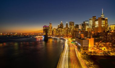 New York City Manhattan skyline panorama at night over Hudson River with refelctions viewed from New Jersey clipart