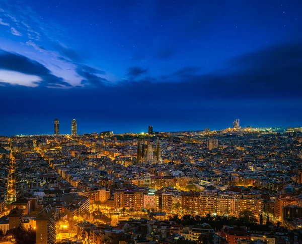 Barcelona city skyline in night time with star and sea background, Barcelona, Spain, Europe
