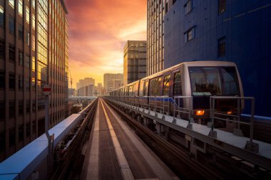 Train in city in Tokyo with sunset background, Tokyo, Japan. This immage can use for Transportation and travel concept in the city clipart