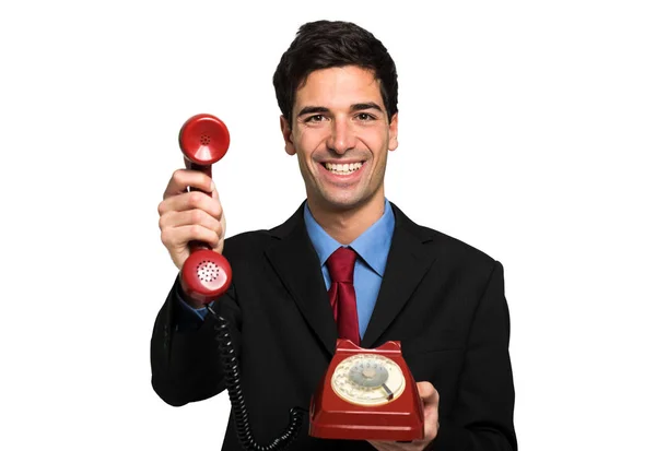 Επιχειρηματίας Κρατώντας Ένα Κόκκινο Vintage Τηλέφωνο — Φωτογραφία Αρχείου