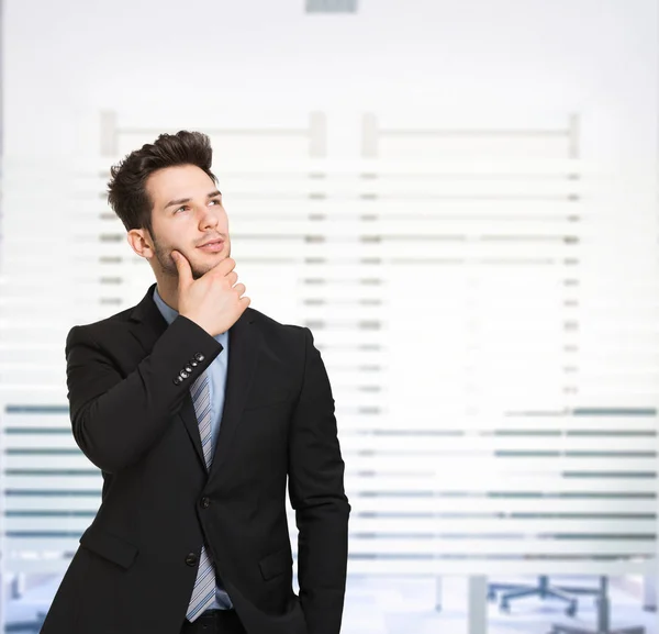 Young Man Looking Large Bright Background Copy Space — Stock Photo, Image