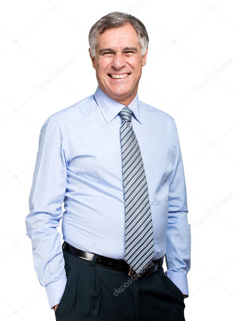 confident mature businessman with hands in the pockets isolated on white background 