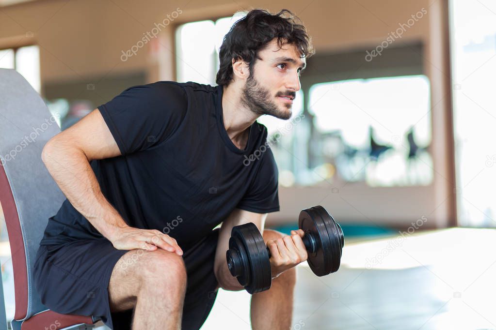 Man lifting weight at the gym