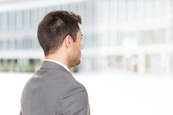 Portrait of a businessman from behind in the city