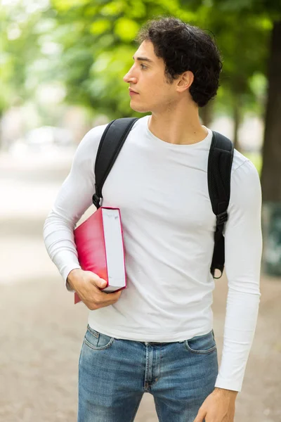 Männlicher Student Hält Buch — Stockfoto