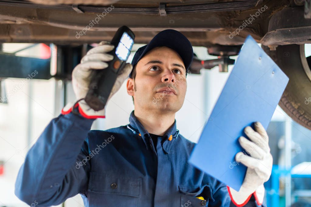 Auto electrician working on a car