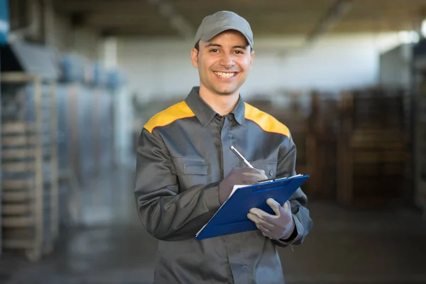 Pensive Industrial Worker Writing Document — Stock Photo, Image