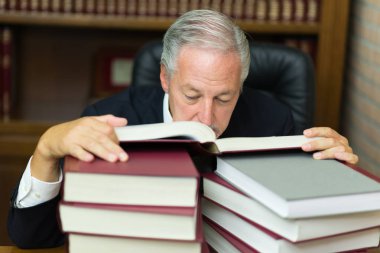 Lawyer reading boring books clipart