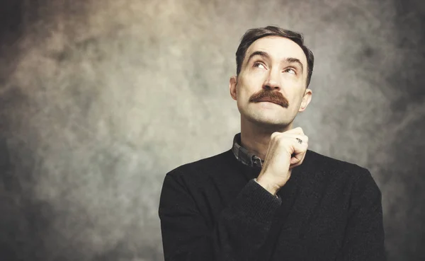 Mature man in a pensive expression