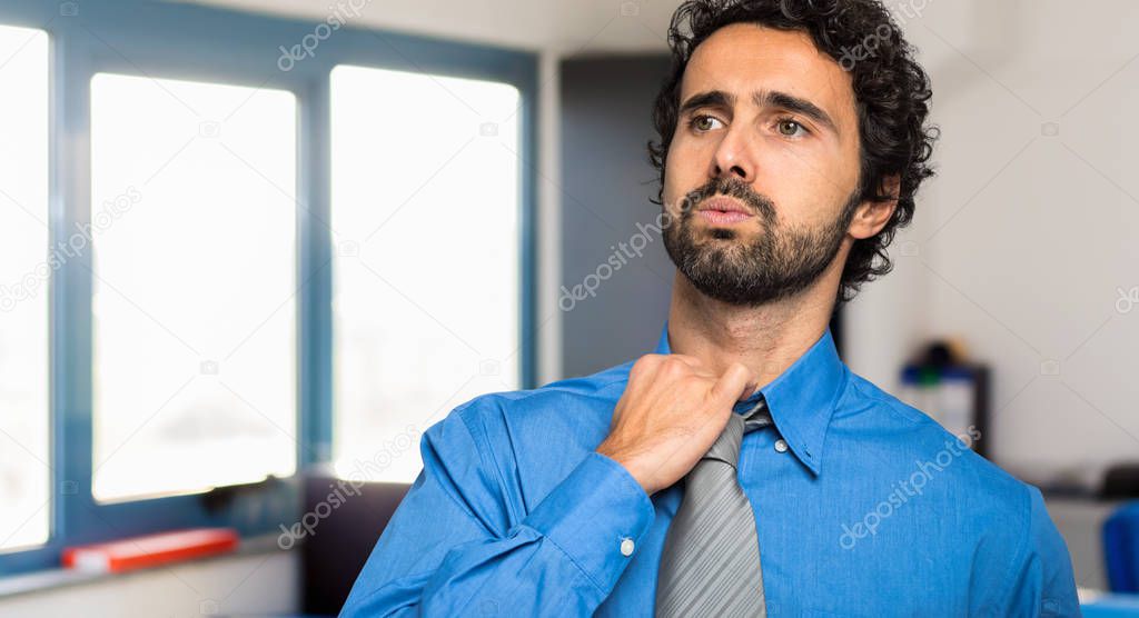 Sweating businessman due to hot climate