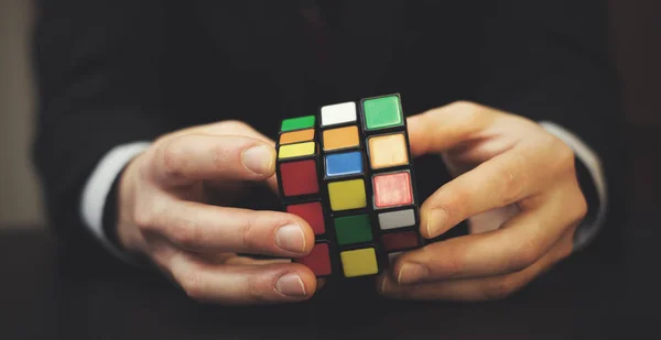 Businessman Trying Solve Rubik Cube — Stock Photo, Image