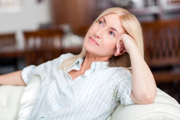 Lovely Middle Aged Blond Woman Sitting Sofa Home — Stock Photo, Image