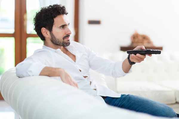Man Couch Switches Remote Control Channels — Stock Photo, Image