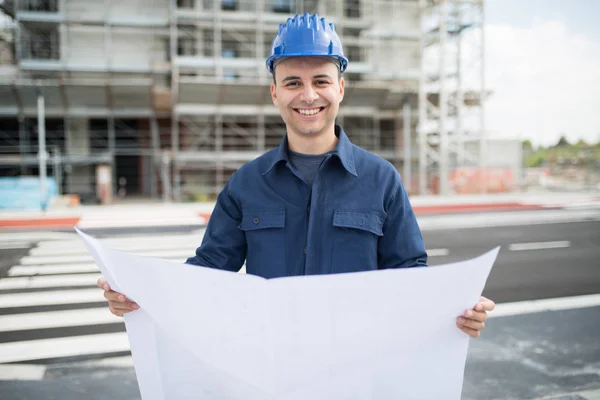 Smiling Site Manager Reading Blueprint Front Construction Site — Stock Photo, Image