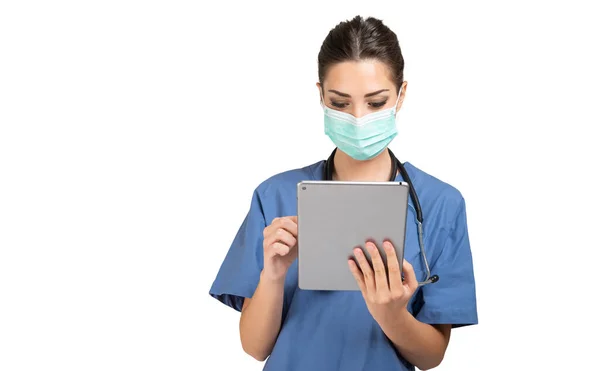 Masked Young Nurse Doctor Using Tablet Isolated White Background — Stock Photo, Image