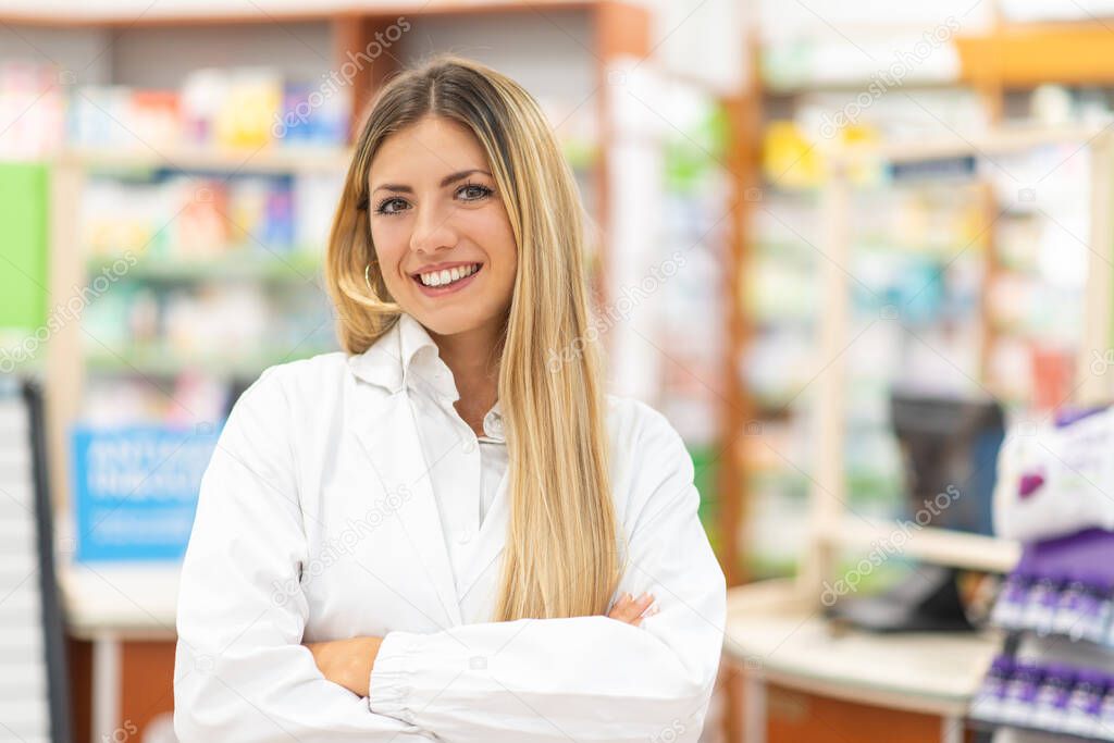 Portrait of a smiling young pharmacist in a pharmacy