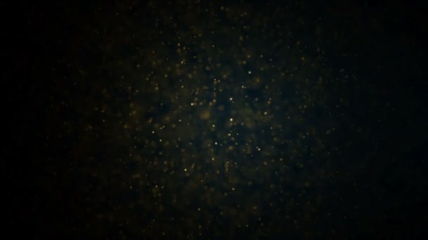 Goldpartikel. natürliche schwimmende organische Teilchen auf herrlich entspanntem Hintergrund. Glitzerpartikel mit Bokeh. Zeitlupe. — Stockvideo