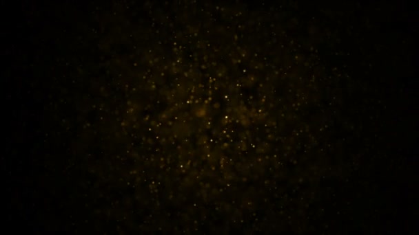 Goldpartikel. natürliche schwimmende organische Teilchen auf herrlich entspanntem Hintergrund. Glitzerpartikel mit Bokeh. Zeitlupe. — Stockvideo