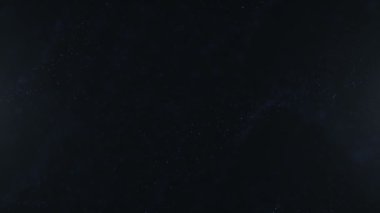 Titreşen parçacıklar, parçacıkların rasgele hareket. Güzel arka plan rahatlatıcı üzerinde. Bokeh ile ışıltılı parçacıklar