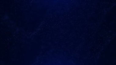 Titreşen parçacıklar, parçacıkların rasgele hareket. Güzel arka plan rahatlatıcı üzerinde. Bokeh ile ışıltılı parçacıklar