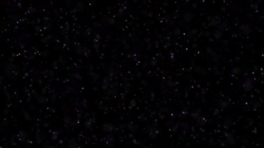 Titreşen parçacıklar, parçacıkların rasgele hareket. Güzel arka plan rahatlatıcı üzerinde. Bokeh ile ışıltılı parçacıklar