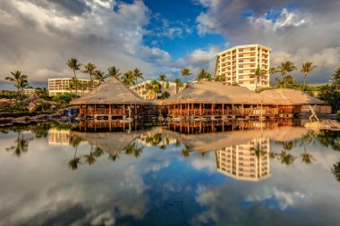Reflection of a luxury tropical resort on the Island of Maui, Hawaii clipart