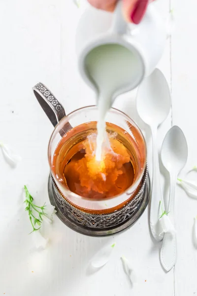 Pouring Milk Glass Tea White Background — Stock Photo, Image