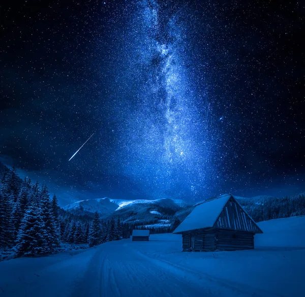 Falling stars, cottages and snowy road at night, Tatra Mountains