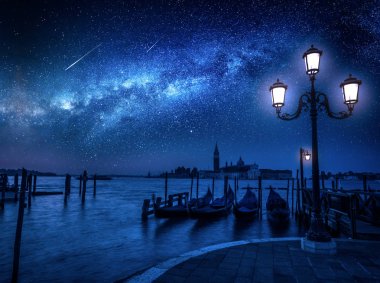 Milky way and falling stars over Grand Canal in Venice clipart