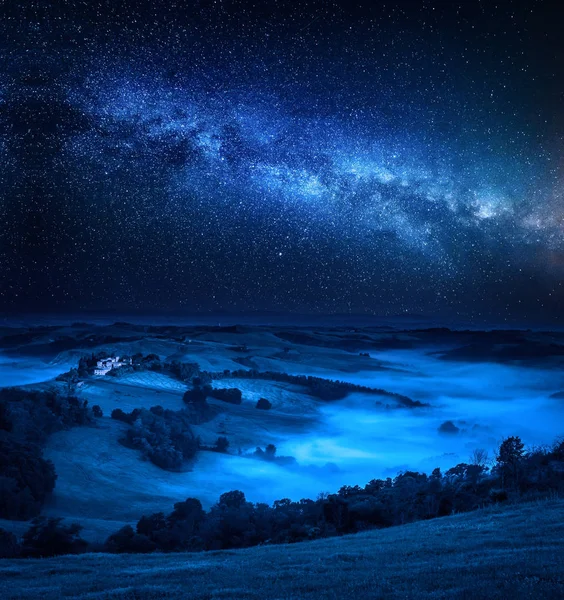 Milky way, falling stars and foggy valley, Italy