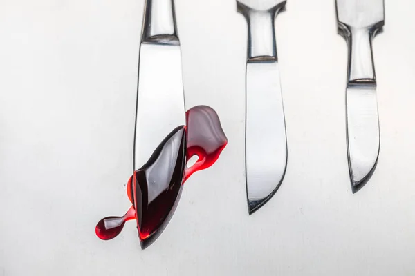 Sharp surgical scalpels with a small amount of blood — Stock Photo, Image