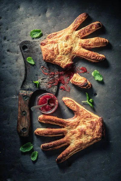 Strange hand cake with strawberry jam as concept of liking — Stock Photo, Image