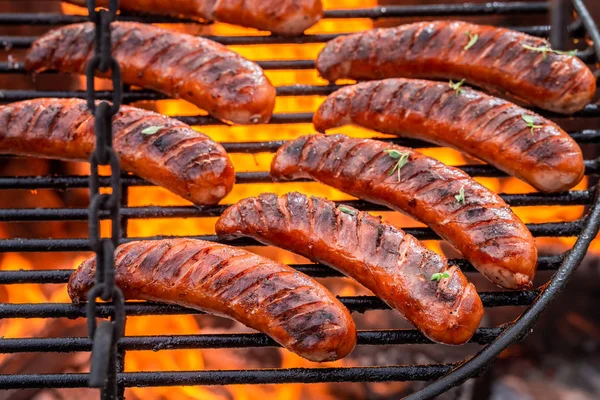 Top view of sausage on grill with spices in summer — Stock Photo, Image