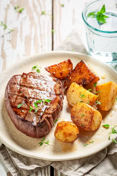 Fresh and tasty steak with roasted potatoes — Stock Photo, Image