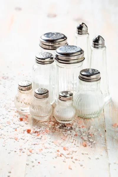 Salt in cellar with different types of salt on table — Stock Photo, Image