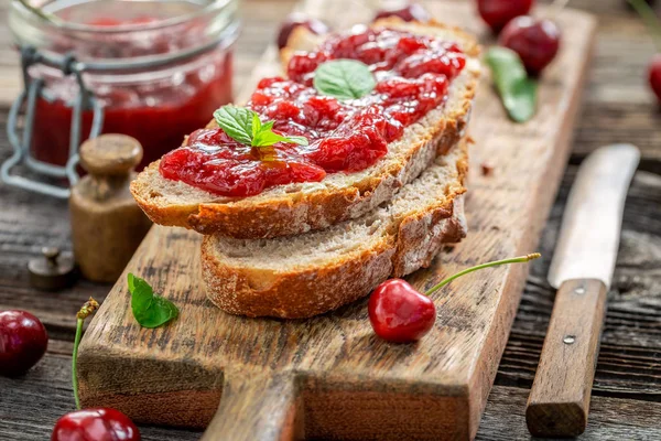 Closeup of fruity sandwich with jam made of cherries — Stock Photo, Image