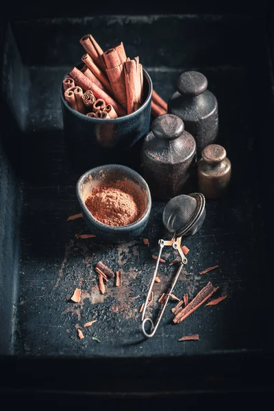 Heap of cinnamon sticks on a dark background — Stock Photo, Image