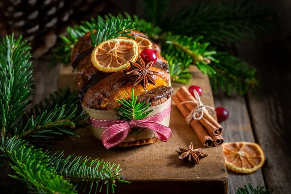 Closeup of orange gingerbread for Christmas decorated with spruce — Stock Photo, Image