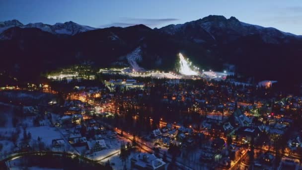 Iluminated Zakopane city in winter at night, air view — Stock video