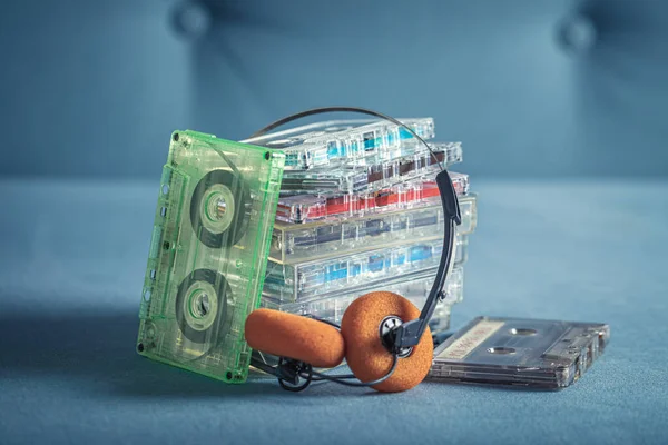 Vintage Stack Audio Cassettes Orange Headphones Blue Sofa — Stock Photo, Image