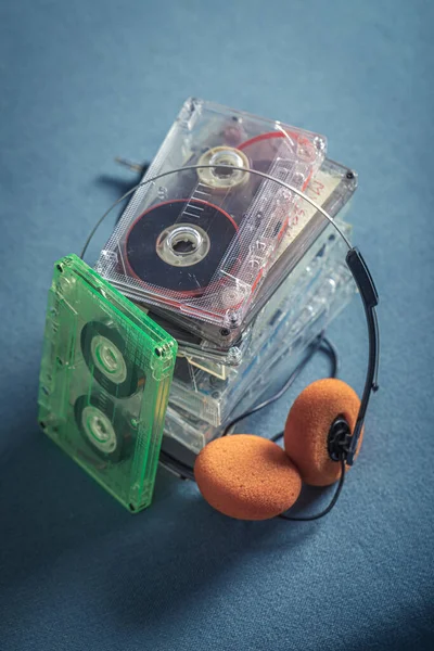 Retro Stack Audio Cassettes Orange Headphones Blue Sofa — Stock Photo, Image