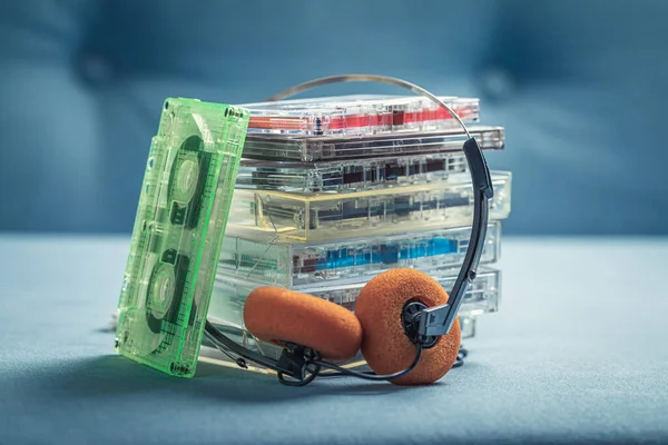 Classic Stack Audio Cassettes Orange Headphones Blue Sofa — Stock Photo, Image