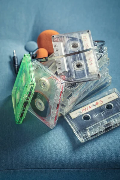 Antique Stack Audio Cassettes Orange Headphones Blue Sofa — Stock Photo, Image